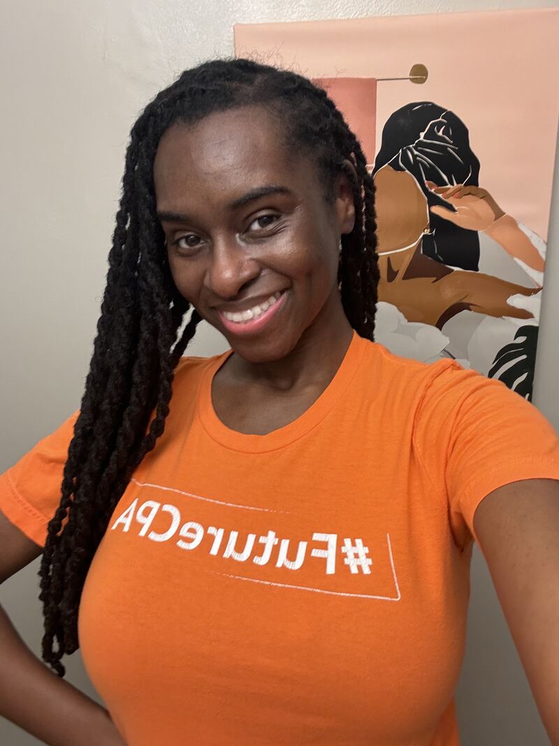 Image of adult Black woman, smiling, wearing an orange t-shirt that reads #FutureCPA on it
