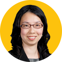 A person holding a sign posing for the camera
Description automatically generated